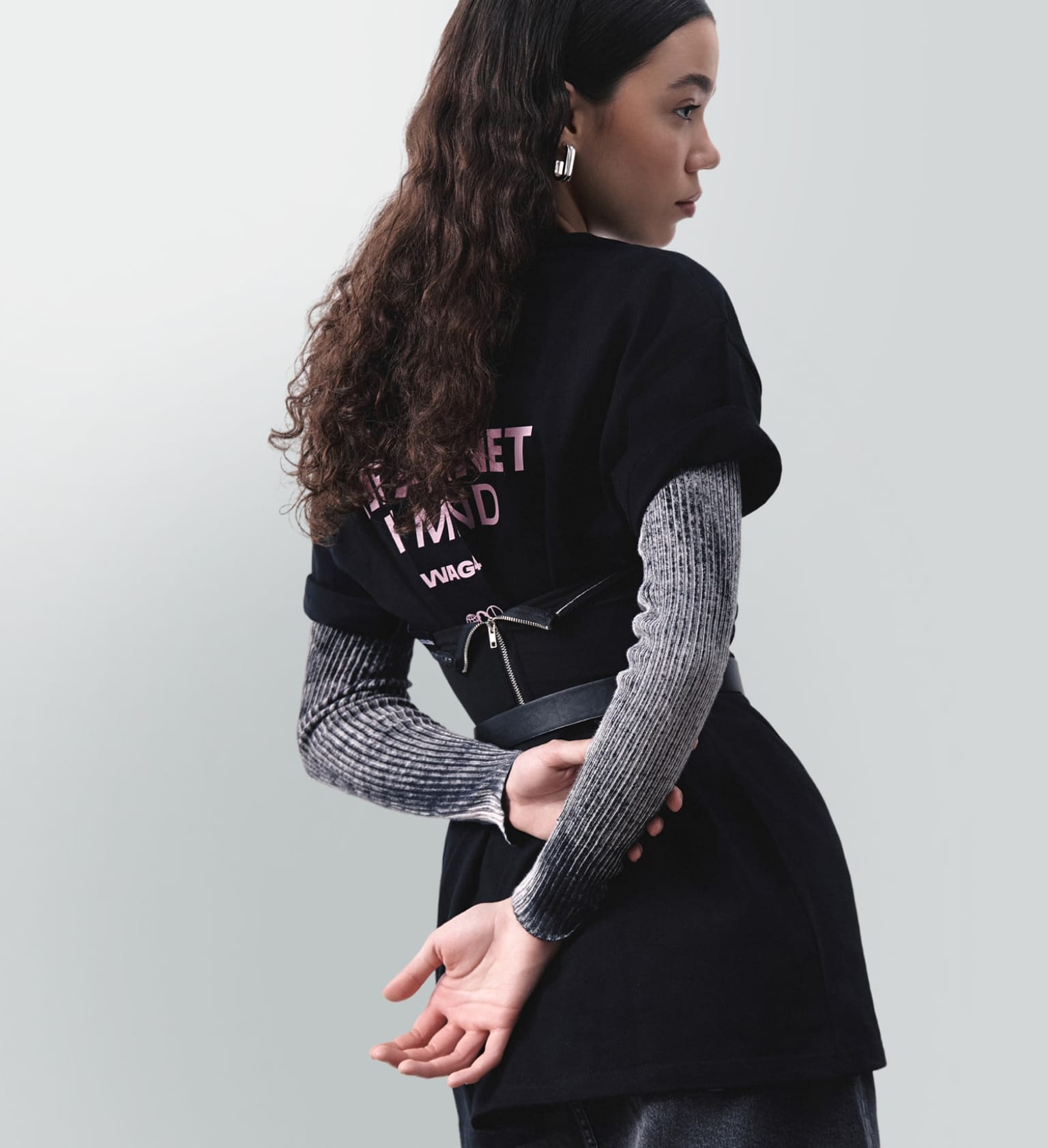 Young woman wearing stylish corporate swag outfit